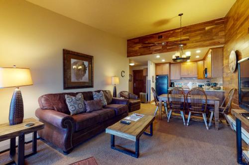 a living room with a couch and a table at Copper Valley 114 in Copper Mountain