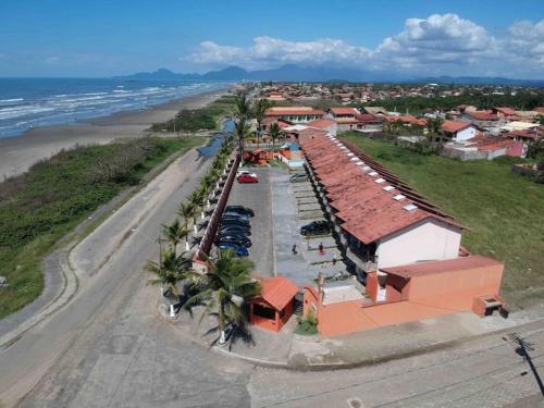an aerial view of a resort on the beach at Pé na areia gaivotas com Wi-Fi in Itanhaém