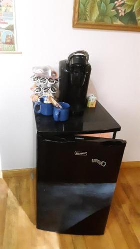 a black cabinet with a coffee maker on top of it at Winterfell Inn - No Xtra Fees, Dogs OK, King & Queen Suites in Arnold