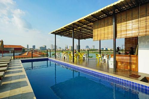 a swimming pool on the roof of a building at Onederz Hostel Phnom Penh in Phnom Penh
