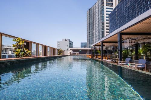 a swimming pool on the side of a building at The Old Clare Hotel, Independent Collection by EVT in Sydney