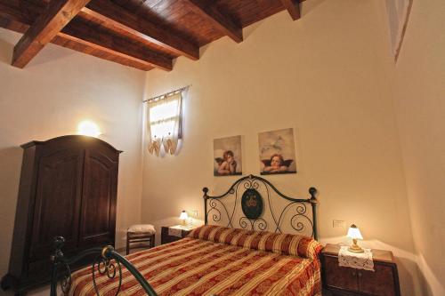 Postel nebo postele na pokoji v ubytování B&B Salita Delle Pere