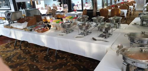 a long table with food on top of it at Harefield Manor Hotel in Romford