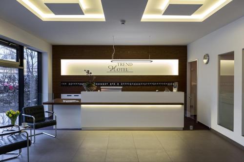 a lobby with a reception desk in a building at Trend Hotel in Banzkow