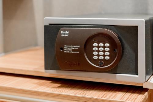 a microwave oven sitting on top of a shelf at Oriens Hotel & Residences Myeongdong in Seoul