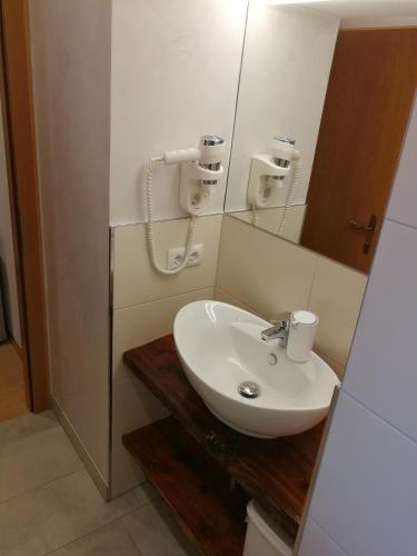 a bathroom with a sink and a mirror at Haus Groder in Rauris