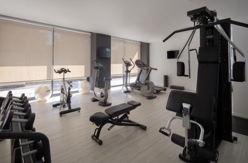 a gym with several exercise bikes in a room at Bordoy Cosmopolitan in Playa de Palma