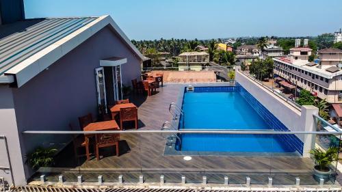 a view of a swimming pool on top of a building at Cosmique Clarks Inn Suites Goa in Madgaon
