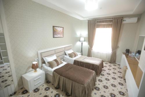 Ένα ή περισσότερα κρεβάτια σε δωμάτιο στο Sumaya Hotel