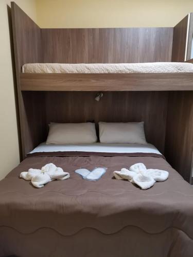 two piles of towels sitting on top of a bed at Fratelli Clemente Spa and Hotel in Castelvetrano Selinunte