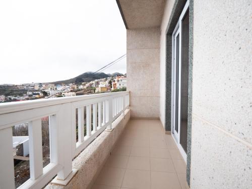 a balcony with a view of a city at Av.Dacio Darias 66, 1ºA Villa de valverde. in Valverde