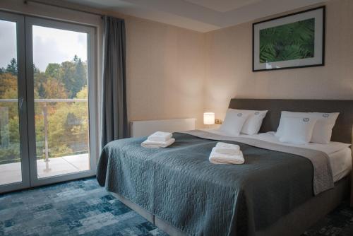 Posteľ alebo postele v izbe v ubytovaní Hotel Grey Spa