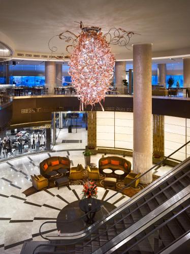 a mall with a large chandelier in the middle at Wyndham Grand Istanbul Europe in Istanbul