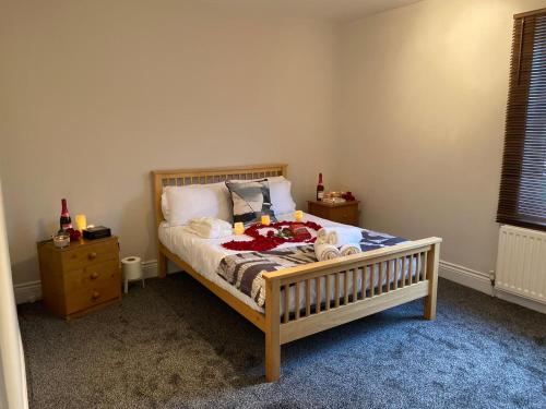 a bedroom with a bed with a wooden frame and a night stand at Washington's Hidden Gem Amethyst 3 Bedroom House in Washington