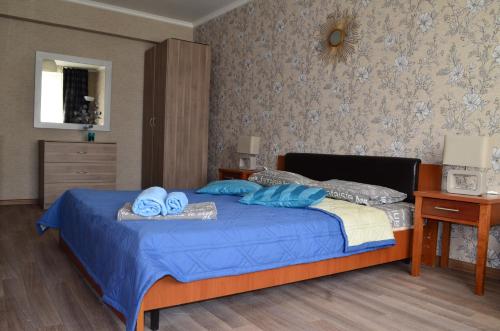 Кровать или кровати в номере Standard Brusnika Apartment Shchyukinskaya