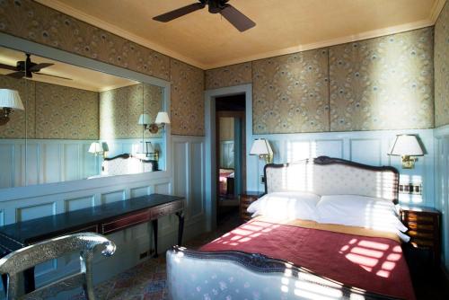 a bedroom with a bed and a dresser at The Jane Hotel in New York