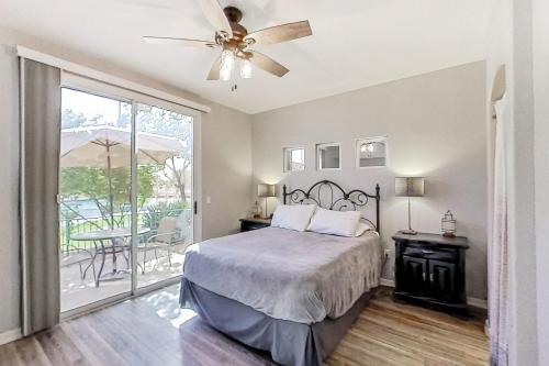 a bedroom with a bed and a ceiling fan at Superstition Springs in Leisure World