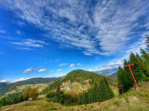 a view of a village on a hill in the mountains at Resort Skrivena in Berane