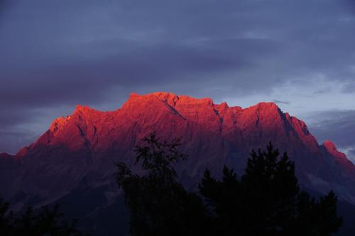 a mountain with a red light on top of it at Ferienhaus Mott in Lermoos