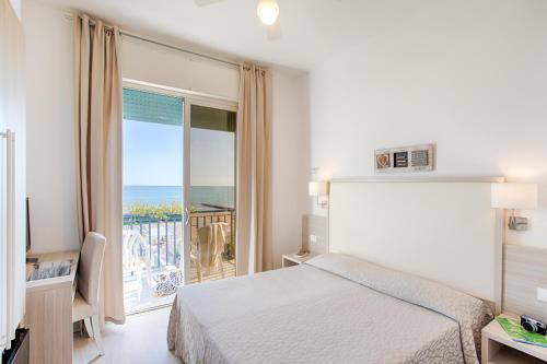 Cama o camas de una habitación en Hotel Conchiglia