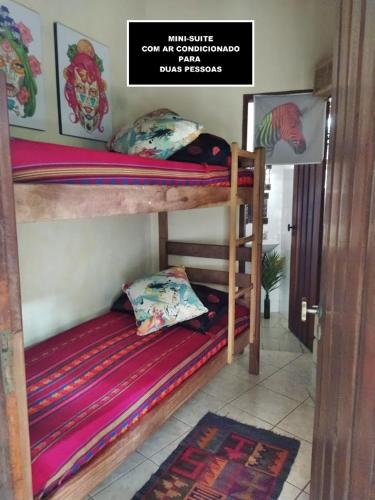 a couple of bunk beds in a room at Casa Vista Para o Mar in Ilhabela