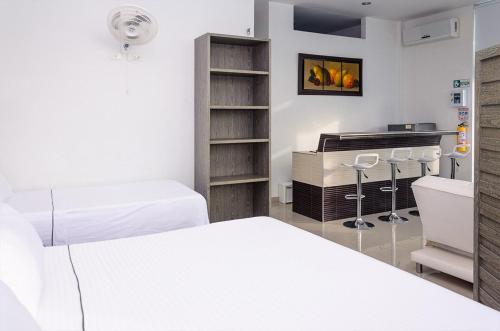 Postel nebo postele na pokoji v ubytování Hotel Boutique San Rafael