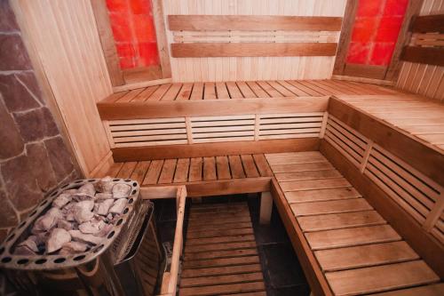 an inside of a sauna with a chair in it at Sofia Hotel in Rivne