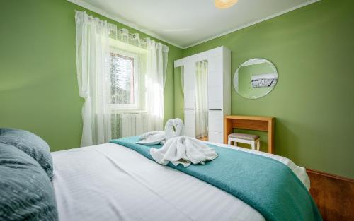 Postel nebo postele na pokoji v ubytování Apartman Giovi