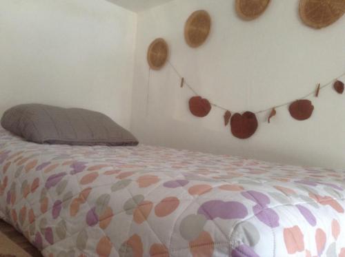 a bedroom with a bed with hearts on the wall at Loft del malecon in Campeche