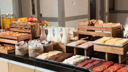a display of different types of bread and pastries at Holiday Inn Express - Antofagasta by IHG in Antofagasta