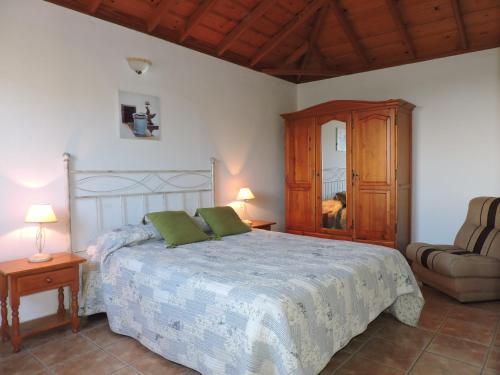 En eller flere senge i et værelse på Casas Las Papayeras, en Los Barros