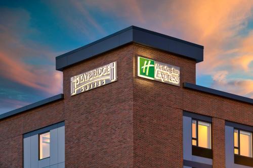 a brick building with a sign on top of it at Holiday Inn Express - Boston Logan Airport - Revere by IHG in Revere