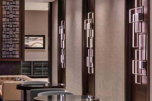 a restaurant with tables and chairs in a room at Holiday Inn Express - Boston Logan Airport - Revere by IHG in Revere