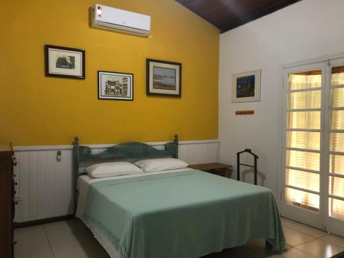 Säng eller sängar i ett rum på Casa Praia da Vila