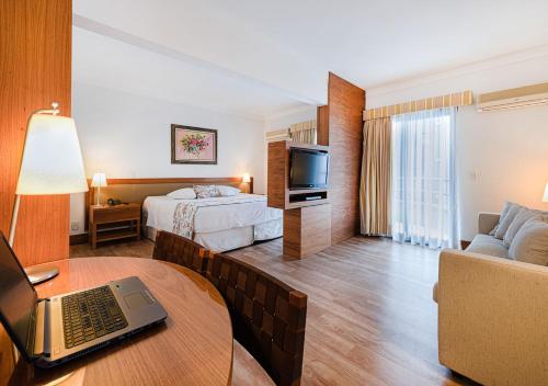 Postel nebo postele na pokoji v ubytování Hotel Nacional Inn Cambuí Campinas Residence
