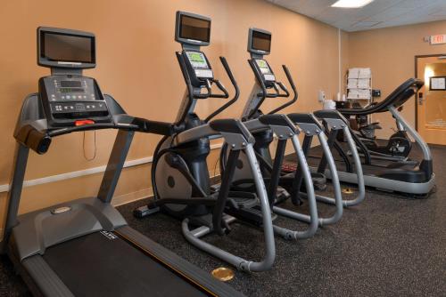 a row of exercise bikes in a fitness room at Holiday Inn Express Breezewood by IHG in Breezewood