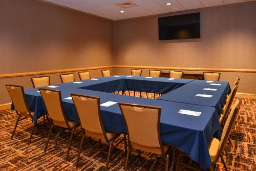 a conference room with a blue table and chairs at Holiday Inn Express Breezewood by IHG in Breezewood