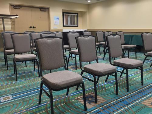 a group of chairs lined up in a room at Holiday Inn Express Chicago NW - Arlington Heights by IHG in Arlington Heights