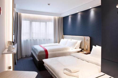 Katil atau katil-katil dalam bilik di Holiday Inn Express - Darmstadt by IHG