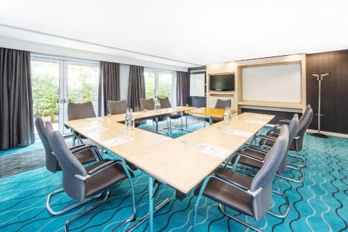 a conference room with a large table and chairs at Holiday Inn Express Folkestone Channel Tunnel by IHG in Folkestone