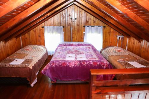Ein Bett oder Betten in einem Zimmer der Unterkunft Pousada da Z