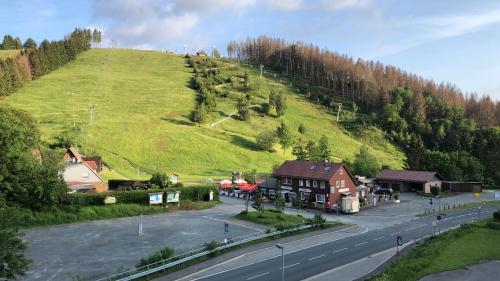 a hill with a house on the side of a road at Breeman im Harz in Sankt Andreasberg