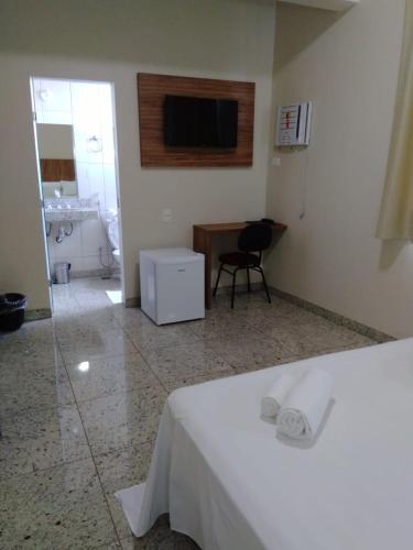 Ένα ή περισσότερα κρεβάτια σε δωμάτιο στο TOPÁZIO IMPERIAL HOTEL