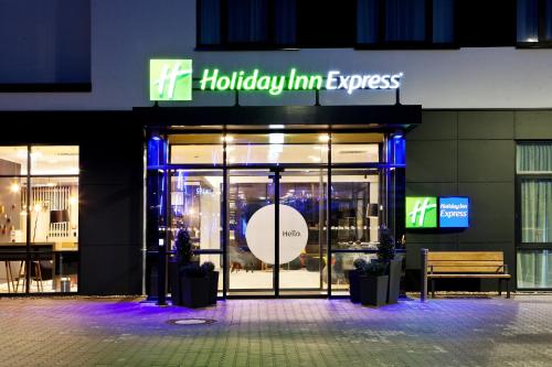 a store front with a sign that reads holiday inn express at Holiday Inn Express - Kaiserslautern by IHG in Kaiserslautern
