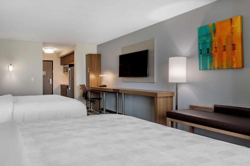 Ένα ή περισσότερα κρεβάτια σε δωμάτιο στο MainStay Suites Waukee-West Des Moines