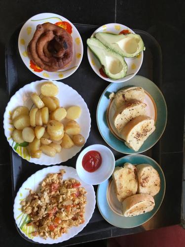a group of plates of food on a table at Tenam Garden homestay in Kalimpong