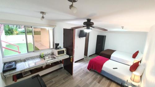 Ein Bett oder Betten in einem Zimmer der Unterkunft Out of Bounds Boutique Hotel