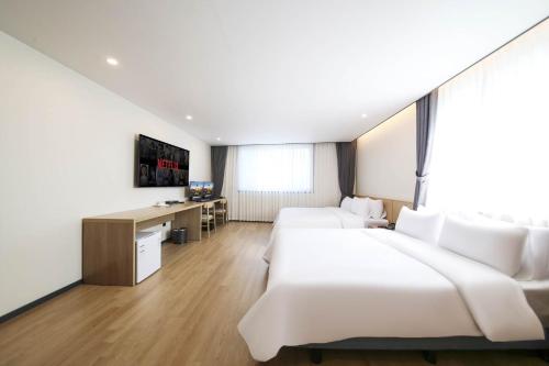 Cama o camas de una habitación en Benikea hotel
