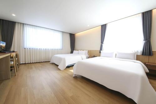 Cama o camas de una habitación en Benikea hotel