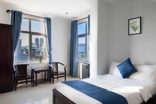 Postel nebo postele na pokoji v ubytování Tehana Beach Hotel Da Nang